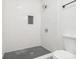 New bathroom features a shower with white subway tile and black hexagon tile floor at 1156 9Th St, Lancaster, SC 29720