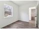 Bedroom featuring a window, wood floors, and view to another room at 1156 9Th St, Lancaster, SC 29720
