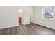 Bedroom with wood flooring leading to an ensuite bathroom and closet at 1156 9Th St, Lancaster, SC 29720