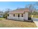 Charming home featuring a covered front porch, light colored siding, and a well-maintained lawn at 1156 9Th St, Lancaster, SC 29720