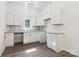 Well-lit kitchen with white cabinetry, granite countertops, and stainless steel sink at 1156 9Th St, Lancaster, SC 29720