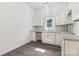Well-lit kitchen with white cabinetry, granite countertops, and stainless steel sink at 1156 9Th St, Lancaster, SC 29720