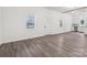 Spacious open floor plan with new floors; kitchen in the background provides a modern living space at 1156 9Th St, Lancaster, SC 29720