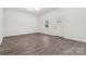 Open concept living room with wood floors and great natural light at 1156 9Th St, Lancaster, SC 29720