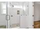 Bathroom with glass shower door and tiled flooring, with an alcove for shampoo storage at 1157 Bunch Dr, Statesville, NC 28677
