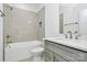 Bathroom with a shower-tub combo with grey tiling and modern finishes at 1157 Bunch Dr, Statesville, NC 28677