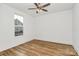 Simple bedroom with hardwood floors, natural light and a view of the neighborhood at 1157 Bunch Dr, Statesville, NC 28677