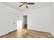 Bedroom with hardwood floors, ceiling fan and a closet with folding doors at 1157 Bunch Dr, Statesville, NC 28677
