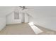 A spacious carpeted upper bedroom with a ceiling fan, neutral walls, and access to other rooms at 1157 Bunch Dr, Statesville, NC 28677