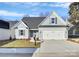 Charming single-Gathering home featuring a two-car garage and beautifully landscaped front yard at 1157 Bunch Dr, Statesville, NC 28677