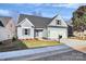 Charming single-Gathering home with a well-maintained lawn, gray siding, and a two-car garage at 1157 Bunch Dr, Statesville, NC 28677