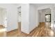 Bright hallway with hardwood floors and white trim leading to various rooms at 1157 Bunch Dr, Statesville, NC 28677