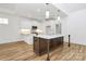 Well-lit kitchen featuring a center island with sink and stainless steel appliances at 1157 Bunch Dr, Statesville, NC 28677