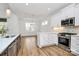 Beautiful kitchen and dining area featuring white cabinets, stainless steel appliances, and backsplash at 1157 Bunch Dr, Statesville, NC 28677