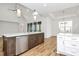 Spacious kitchen with a large island, stainless steel appliances, hardwood floors and lots of natural light at 1157 Bunch Dr, Statesville, NC 28677