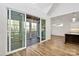 Open living area features a view to an enclosed porch and hardwood flooring at 1157 Bunch Dr, Statesville, NC 28677