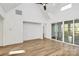 Bright living room area featuring a ceiling fan, hardwood floors, and access to a screened in porch at 1157 Bunch Dr, Statesville, NC 28677