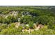 Stunning aerial view of a neighborhood nestled among lush green trees and winding streets at 1286 Saint Katherines Way, Rock Hill, SC 29732