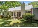Charming backyard with patio seating, lush green grass, and a well-maintained exterior at 1286 Saint Katherines Way, Rock Hill, SC 29732