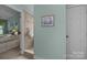 Bathroom with tiled shower and a view into the bedroom with twin beds at 1286 Saint Katherines Way, Rock Hill, SC 29732