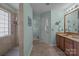 Open bathroom featuring a walk-in shower, double vanity, and neutral tiling at 1286 Saint Katherines Way, Rock Hill, SC 29732