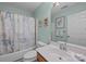 Well-lit bathroom featuring a shower and tub combination with matching patterned shower curtain at 1286 Saint Katherines Way, Rock Hill, SC 29732