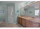 Large bathroom with double vanity, tile floors, and soft, neutral colors at 1286 Saint Katherines Way, Rock Hill, SC 29732