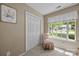 Cozy bedroom featuring neutral tones, a window with tree views, closet and an accent chair at 1286 Saint Katherines Way, Rock Hill, SC 29732