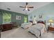 Comfortable bedroom with twin beds, a ceiling fan, and natural light at 1286 Saint Katherines Way, Rock Hill, SC 29732