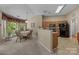 The dining area has a table set for six, and is surrounded by large windows at 1286 Saint Katherines Way, Rock Hill, SC 29732