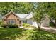 Beautiful home with a brick accent wall and siding on the front, as well as pretty landscaping at 1286 Saint Katherines Way, Rock Hill, SC 29732