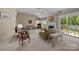 Cozy living room featuring a fireplace, ceiling fan, and a sliding glass door at 1286 Saint Katherines Way, Rock Hill, SC 29732