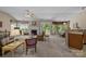 Bright living room featuring a fireplace, ceiling fan, and access to the kitchen and dining area at 1286 Saint Katherines Way, Rock Hill, SC 29732