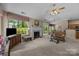 Spacious living room featuring a fireplace and sliding glass doors to the backyard at 1286 Saint Katherines Way, Rock Hill, SC 29732