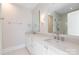Elegant bathroom features double sinks with marble countertops and a large mirror at 3115 Pinehurst Pl, Charlotte, NC 28209