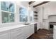 Modern kitchen featuring stainless steel appliances, granite countertops, and stylish open shelving at 3115 Pinehurst Pl, Charlotte, NC 28209