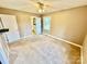 Bedroom with carpeted floors, ceiling fan, and ensuite bathroom at 132 Pisgah Church Rd, Statesville, NC 28625