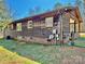 Exterior view of a wood-sided ranch-style home and a well-maintained lawn at 132 Pisgah Church Rd, Statesville, NC 28625