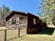 Wood exterior, with a fence, brick foundation, and beautiful lawn at 132 Pisgah Church Rd, Statesville, NC 28625