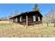 Rear side of a home showcasing the wooden siding and the surrounding landscape at 132 Pisgah Church Rd, Statesville, NC 28625