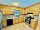 Kitchen featuring wooden cabinets, stainless steel appliances, and a window above the sink at 132 Pisgah Church Rd, Statesville, NC 28625