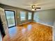 Empty living room with beautiful wood-look flooring and gray walls at 132 Pisgah Church Rd, Statesville, NC 28625