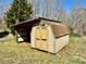 A shed sits in the backyard on a sunny day at 132 Pisgah Church Rd, Statesville, NC 28625