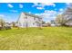 Expansive backyard with mature trees and partial fencing at 13705 Queenswater Ln, Charlotte, NC 28273