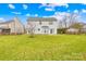 Backyard featuring well-maintained lawn, privacy fence, and mature trees at 13705 Queenswater Ln, Charlotte, NC 28273