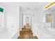 Modern bathroom with double sinks, walk-in shower, and a sliding glass door at 13705 Queenswater Ln, Charlotte, NC 28273