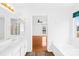 Bright, modern bathroom with double sinks and a view of another room at 13705 Queenswater Ln, Charlotte, NC 28273