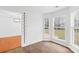 Bright bedroom features hardwood floors, large windows for natural light, and a height chart on the wall at 13705 Queenswater Ln, Charlotte, NC 28273
