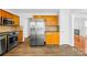 Well-equipped kitchen featuring stainless steel appliances and warm wood cabinetry at 13705 Queenswater Ln, Charlotte, NC 28273