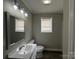 Updated bathroom featuring modern vanity, stylish fixtures, and ample natural light at 1408 Linwood Rd, Gastonia, NC 28052